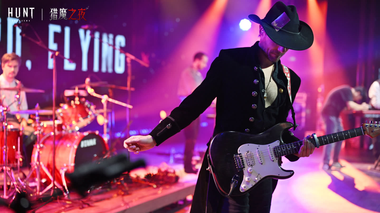 Chris Green playing a Stratocaster under stage lights at a Hunt: Showdown live show